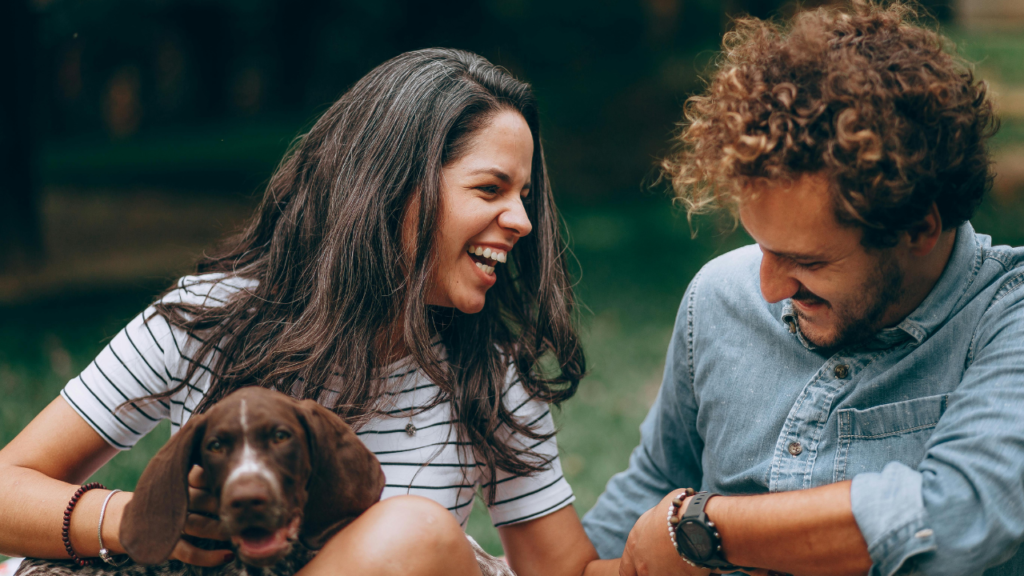Happy Couple Enjoying Time with Pet Dog