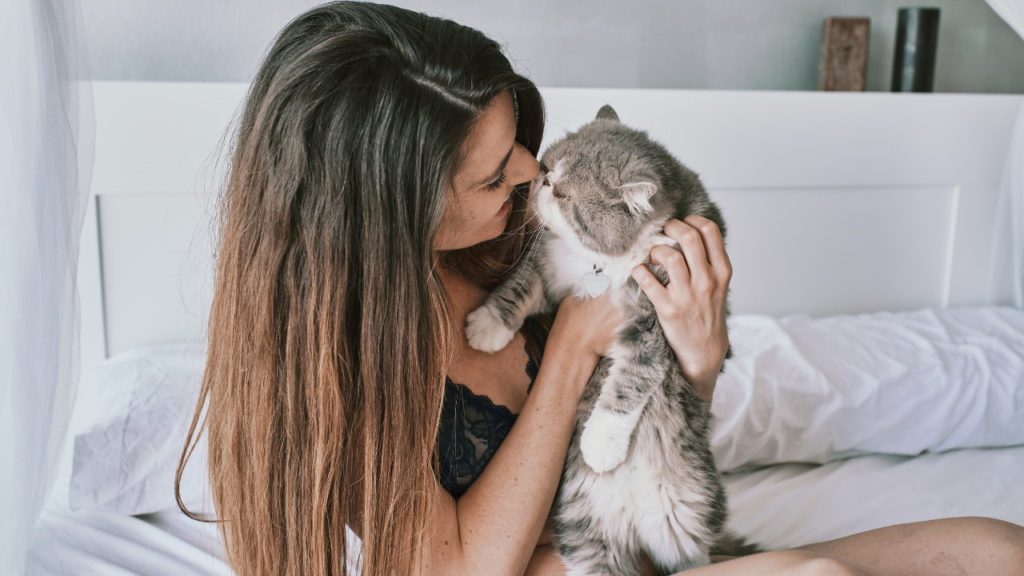 Woman Petting Her Cat